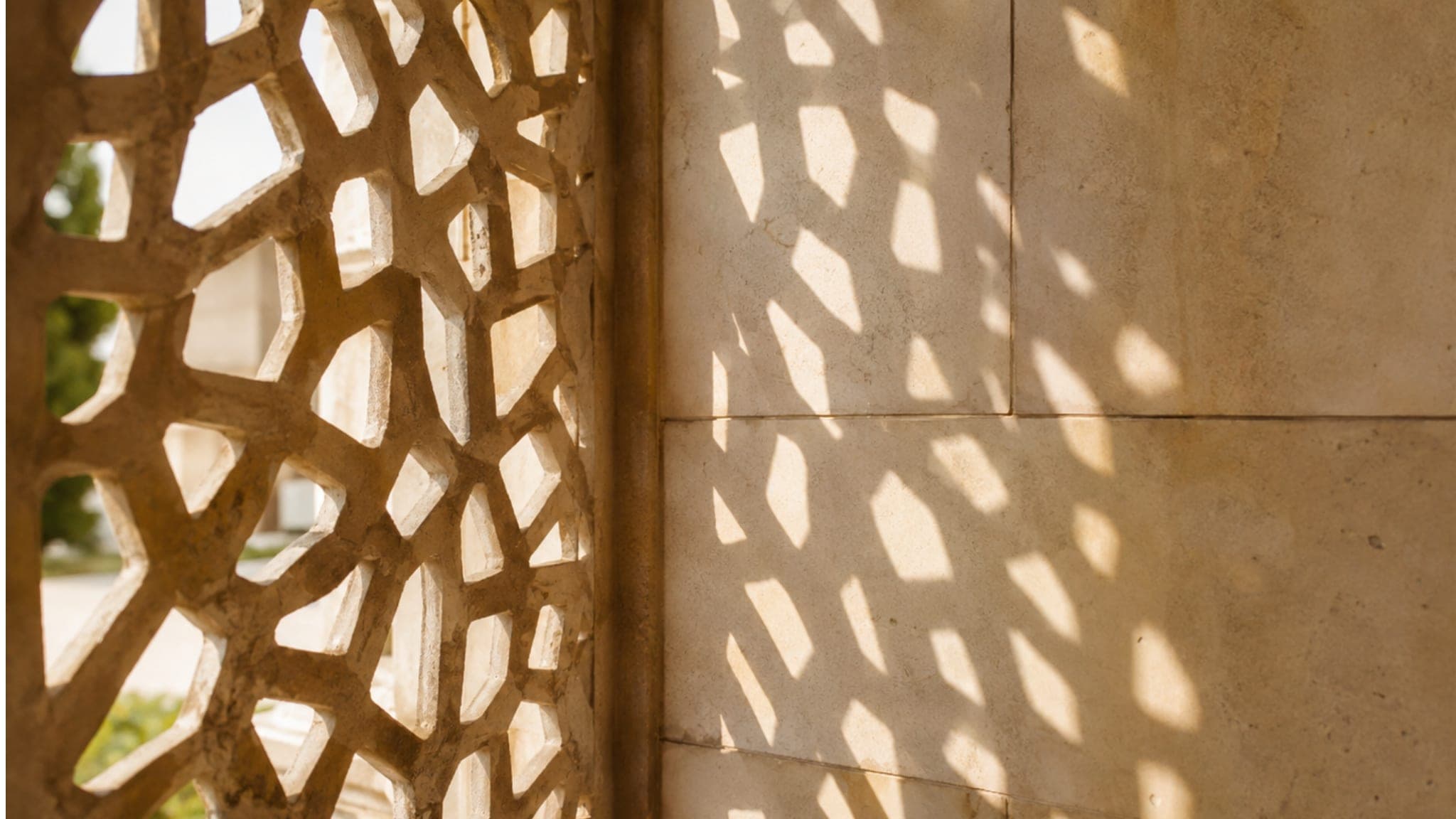 Sunlight through a carved stone jaali screen